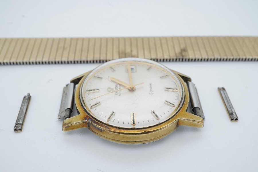 A gentleman's mid 20th century steel and gold plated Omega Automatic wrist watch, with baton numerals and date aperture, case diameter 34mm, on an associated flexible strap (a.f.), no box or papers. Condition - running b